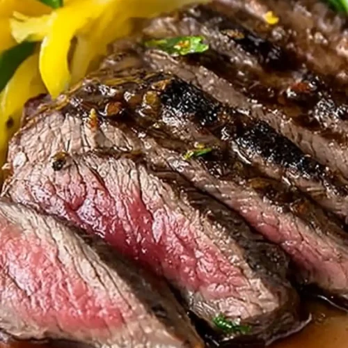Perfect Sous Vide Flank Steak Recipe 27 Sous vide flank steak sliced and served on a wooden cutting board